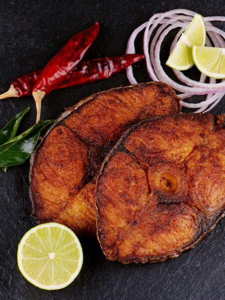 BBQ Flying Fish served with lime garnish