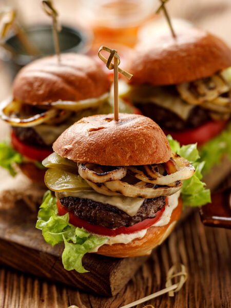 Nice 'n' Spicy Beef Burgers served on a wooden board