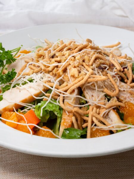 Oriental Chicken Salad served in a white bowl