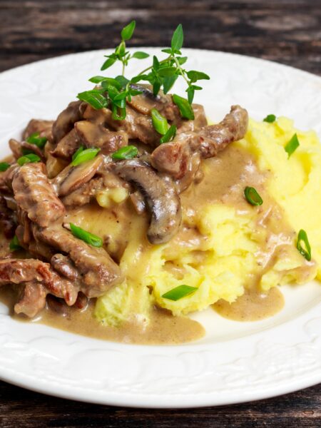 Pork Stroganoff served on a white plate