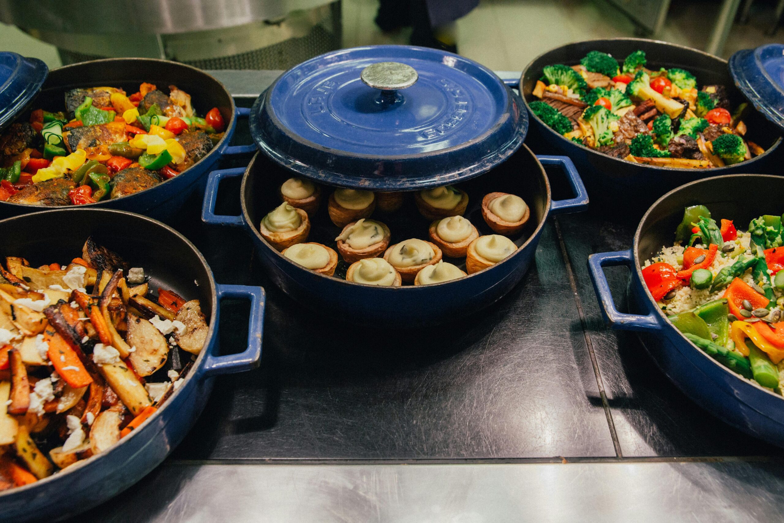 Pots of food at the serving pass