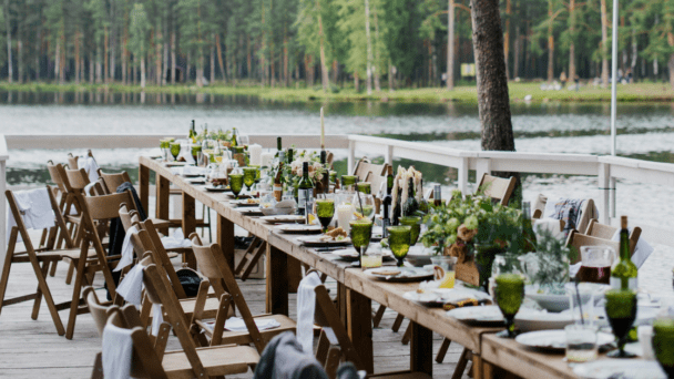 Banquet table beside a lake