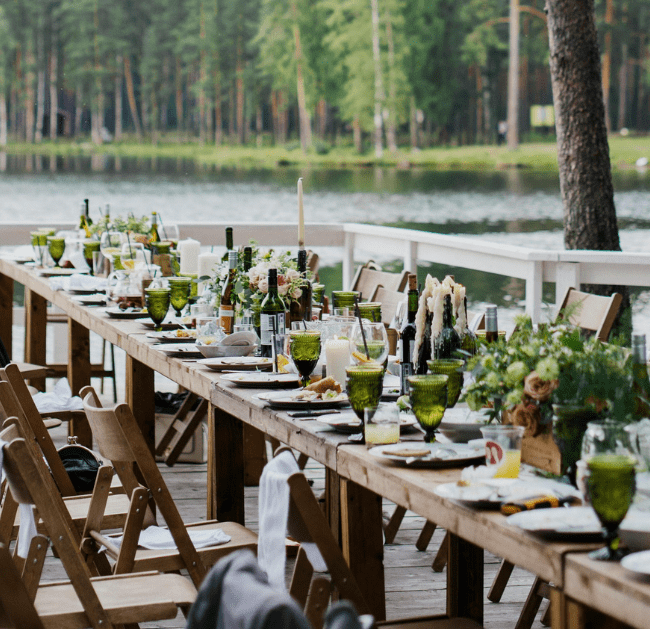 Banquet table beside a lake