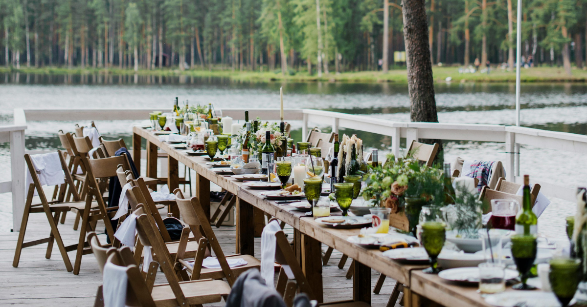 Banquet table beside a lake